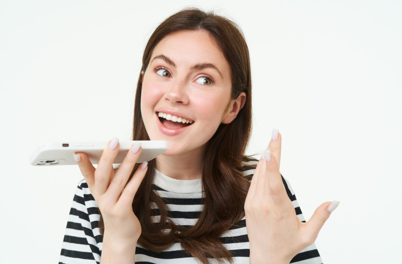 A woman using voice search on a smartphone.