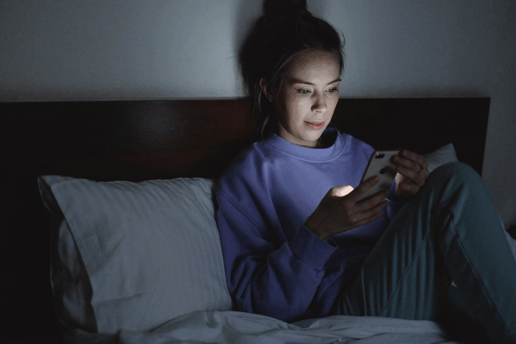 Late-night search behavior on a smartphone in a quiet bedroom.