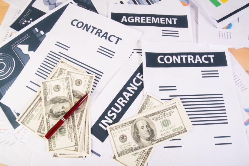 Financial terms trending on social media reflected in contracts, money, and insurance documents.